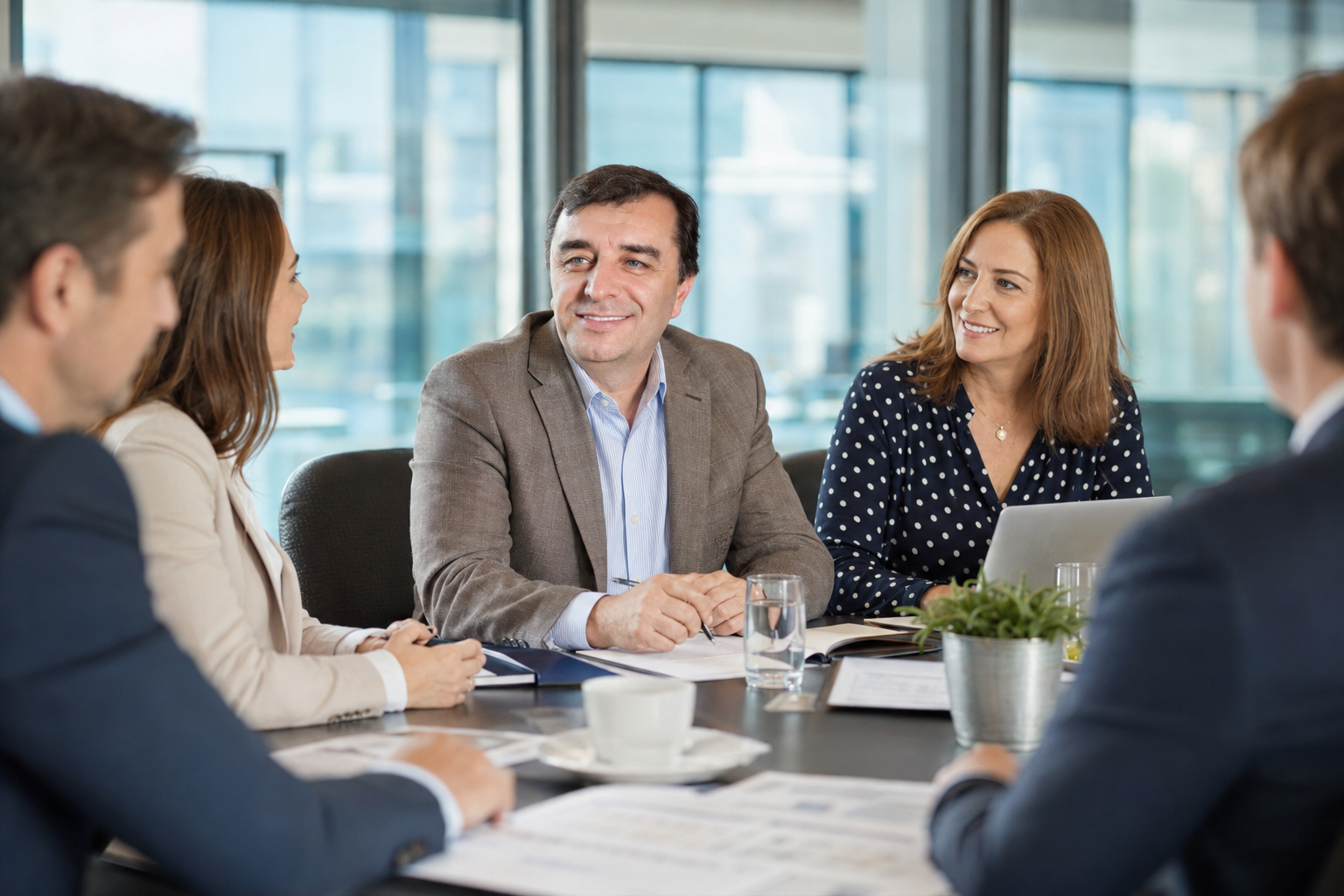 AI-Godoit consultants meeting with business owners around a boardroom table